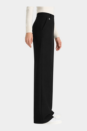 Pantalone a palazzo nero Follower SRL in tessuto compact con tasche laterali e dettaglio metallico in vita