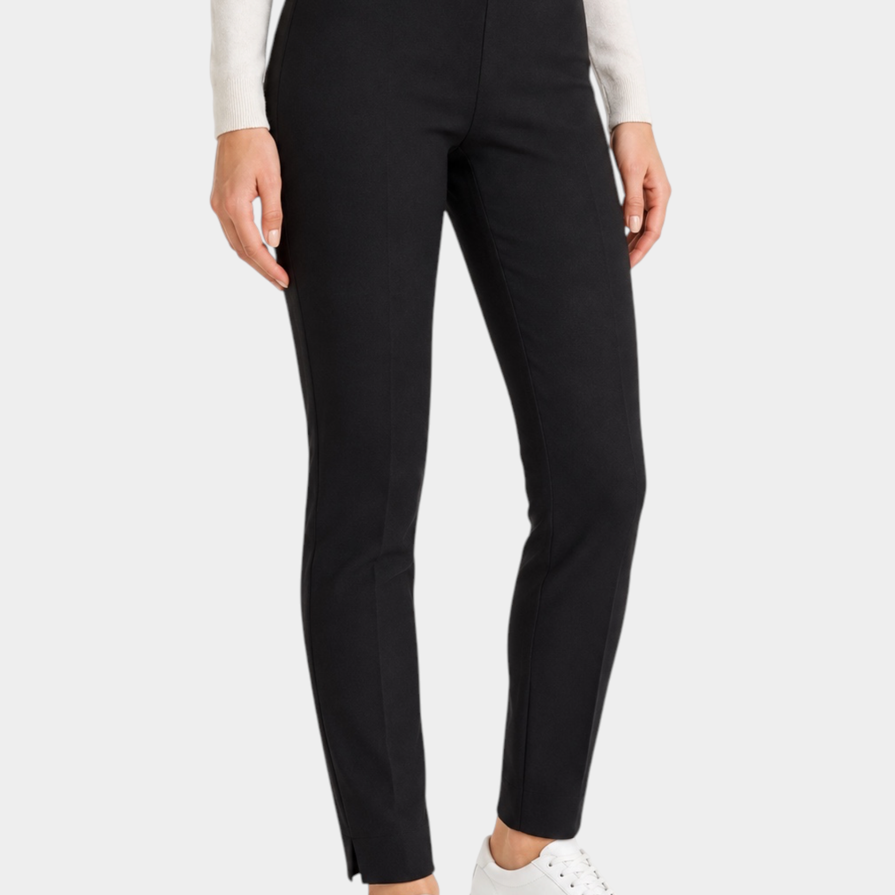 Pantalone a sigaretta nero Follower SRL in tessuto compact con spacchetti sul fondo indossato con sneakers bianche