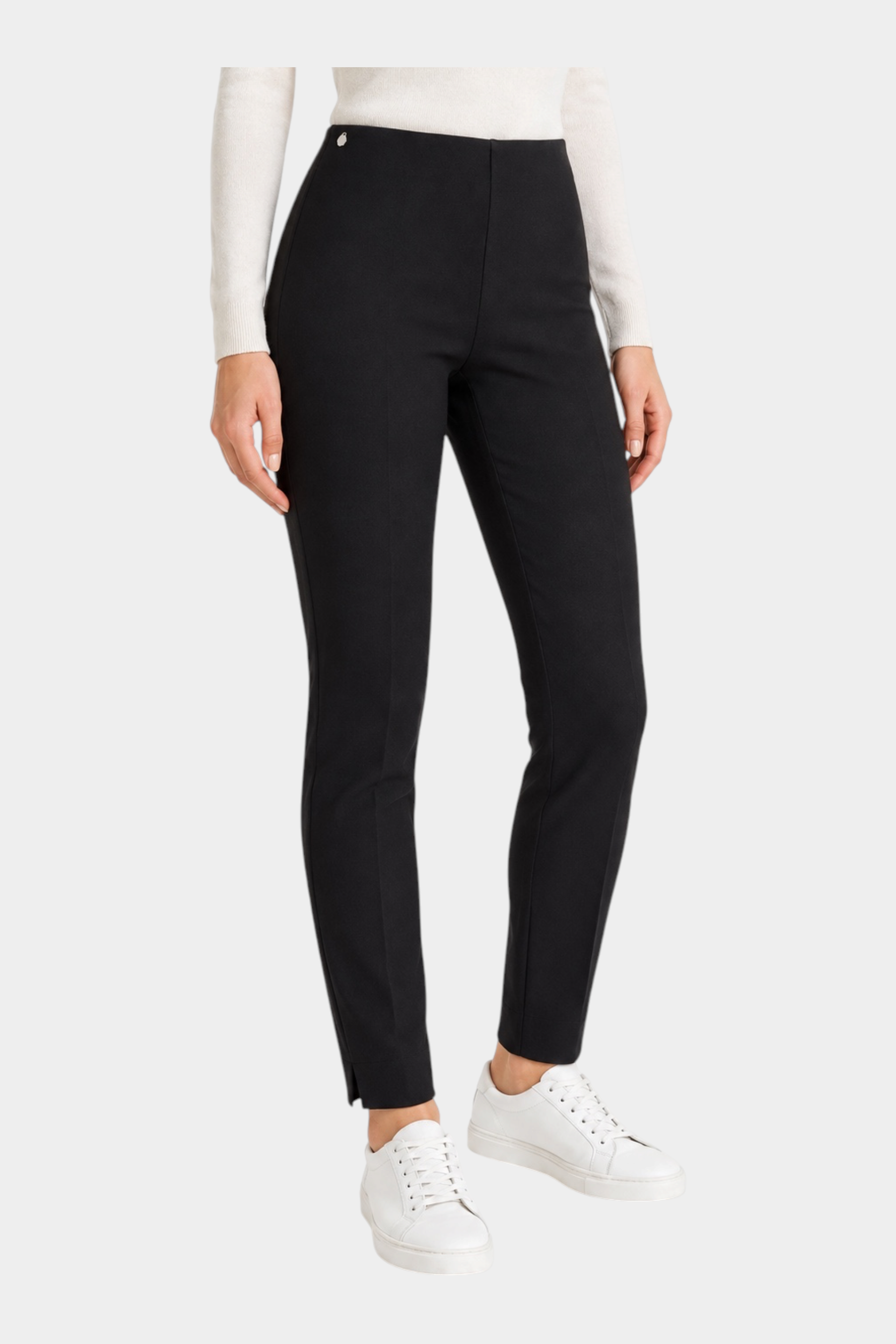 Pantalone a sigaretta nero Follower SRL in tessuto compact con spacchetti sul fondo indossato con sneakers bianche