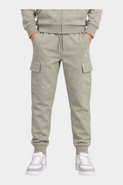 Pantaloni cargo beige Follower SRL in cotone con tasche laterali e polsini elasticizzati indossati da un ragazzo