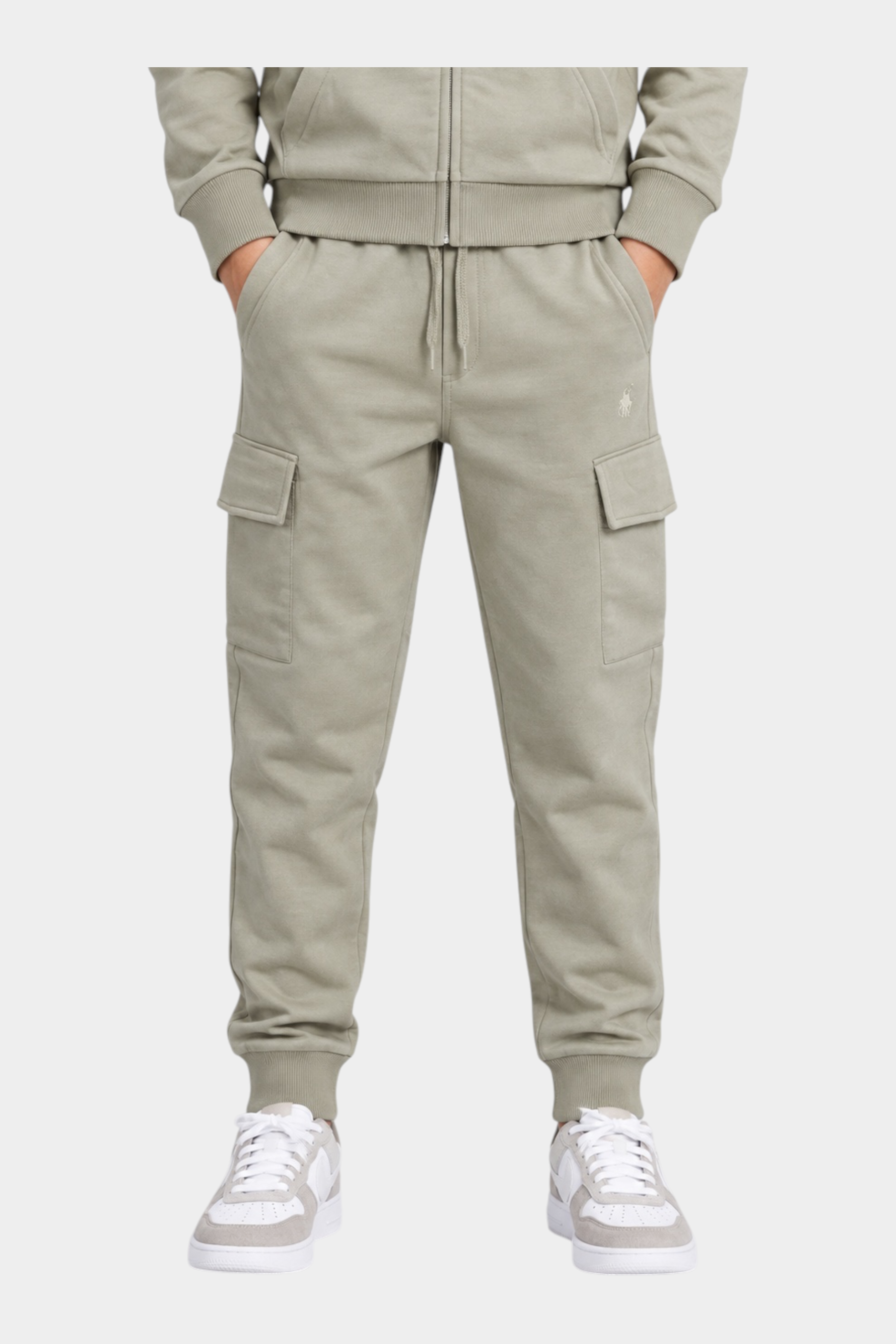 Pantaloni cargo beige Follower SRL in cotone con tasche laterali e polsini elasticizzati indossati da un ragazzo