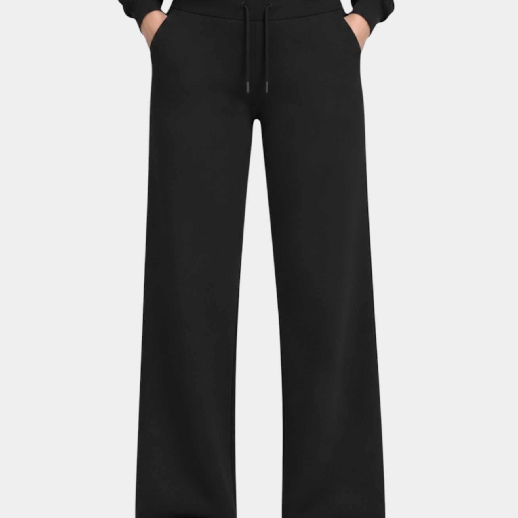 Modella indossa pantaloni jogger neri GUESS con felpa coordinata, stile casual sportivo firmato Follower SRL