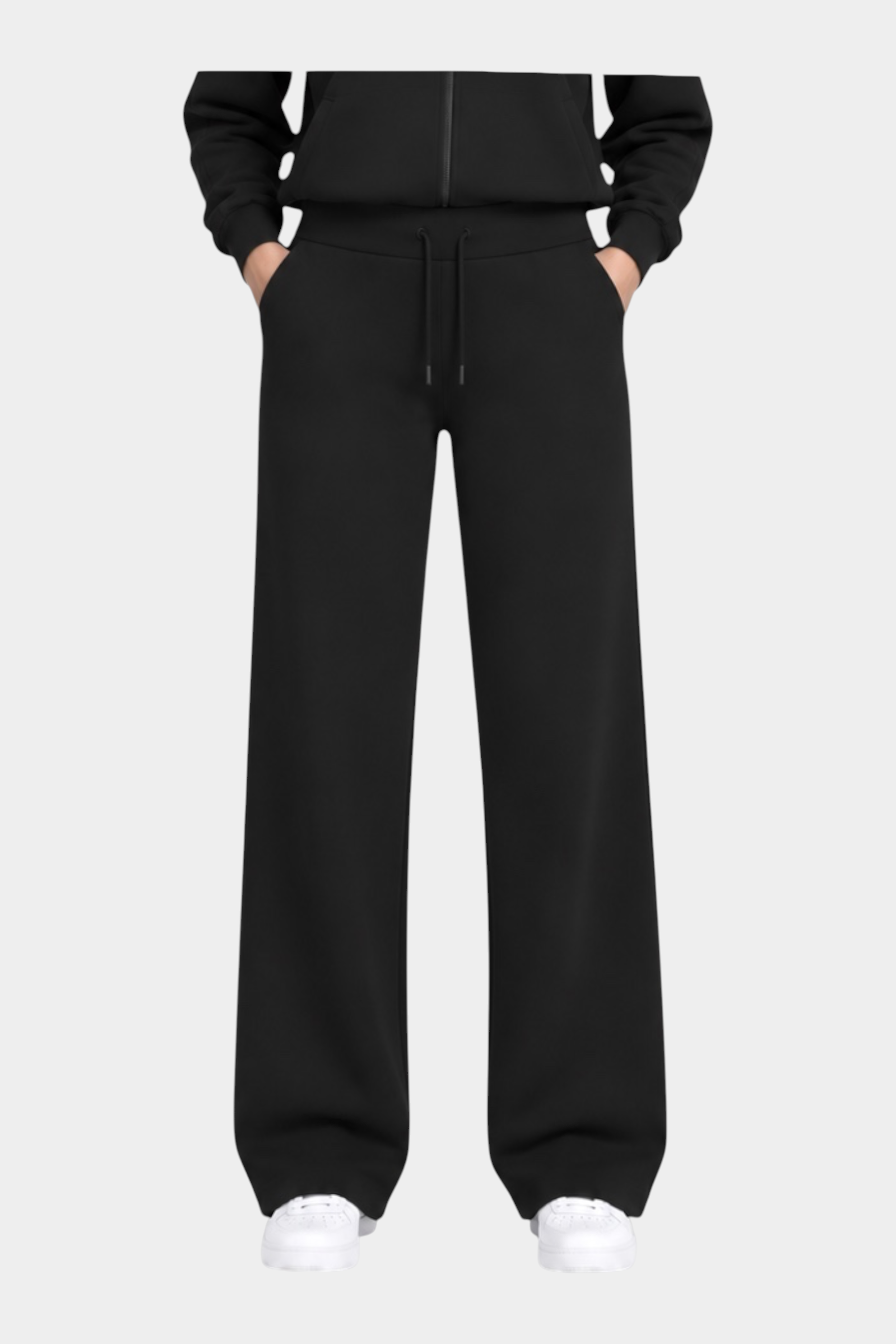 Modella indossa pantaloni jogger neri GUESS con felpa coordinata, stile casual sportivo firmato Follower SRL