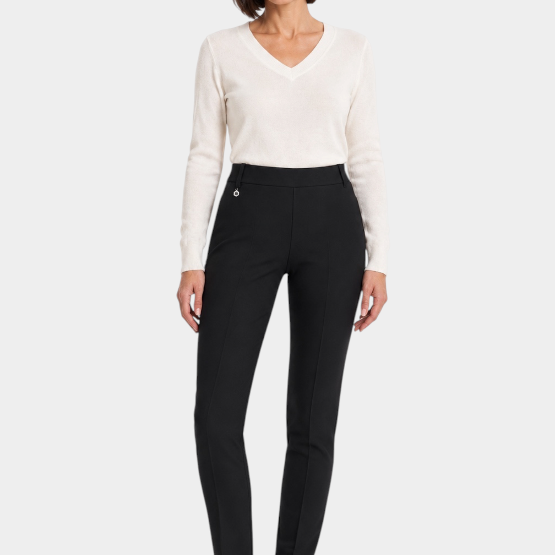 Follower SRL RAGNO women's black cigarette trousers with belt loops, styled with a white V-neck sweater and sneakers.