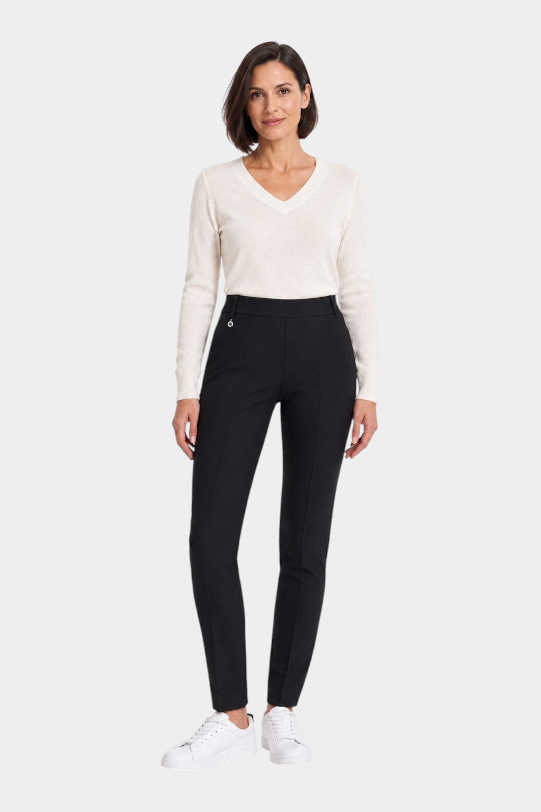 Follower SRL RAGNO women's black cigarette trousers with belt loops, styled with a white V-neck sweater and sneakers.