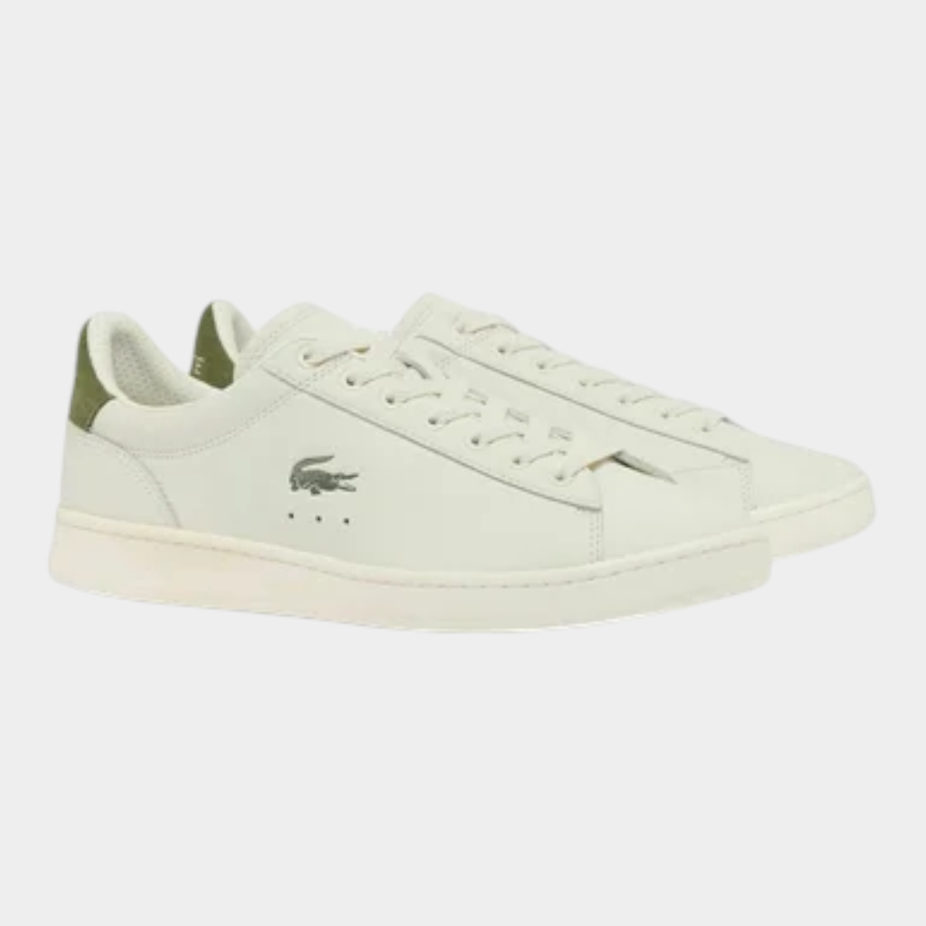 Sneakers Lacoste Carnaby da uomo in pelle bianca con dettagli verdi e logo laterale, vendute da Follower SRL