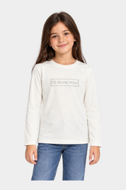Bambina indossa una t-shirt bianca a maniche lunghe Follower SRL con logo US GRAND POLO decorato in strass
