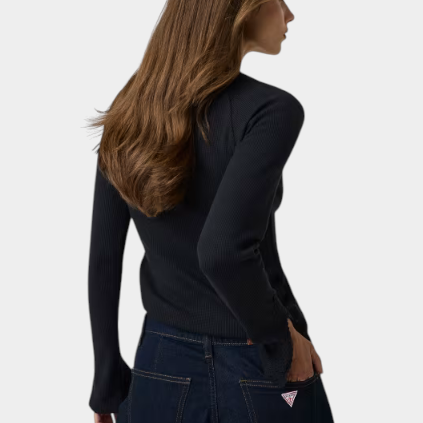 Top nero a maniche lunghe in pizzo di Follower SRL indossato da una modella di spalle con jeans scuri