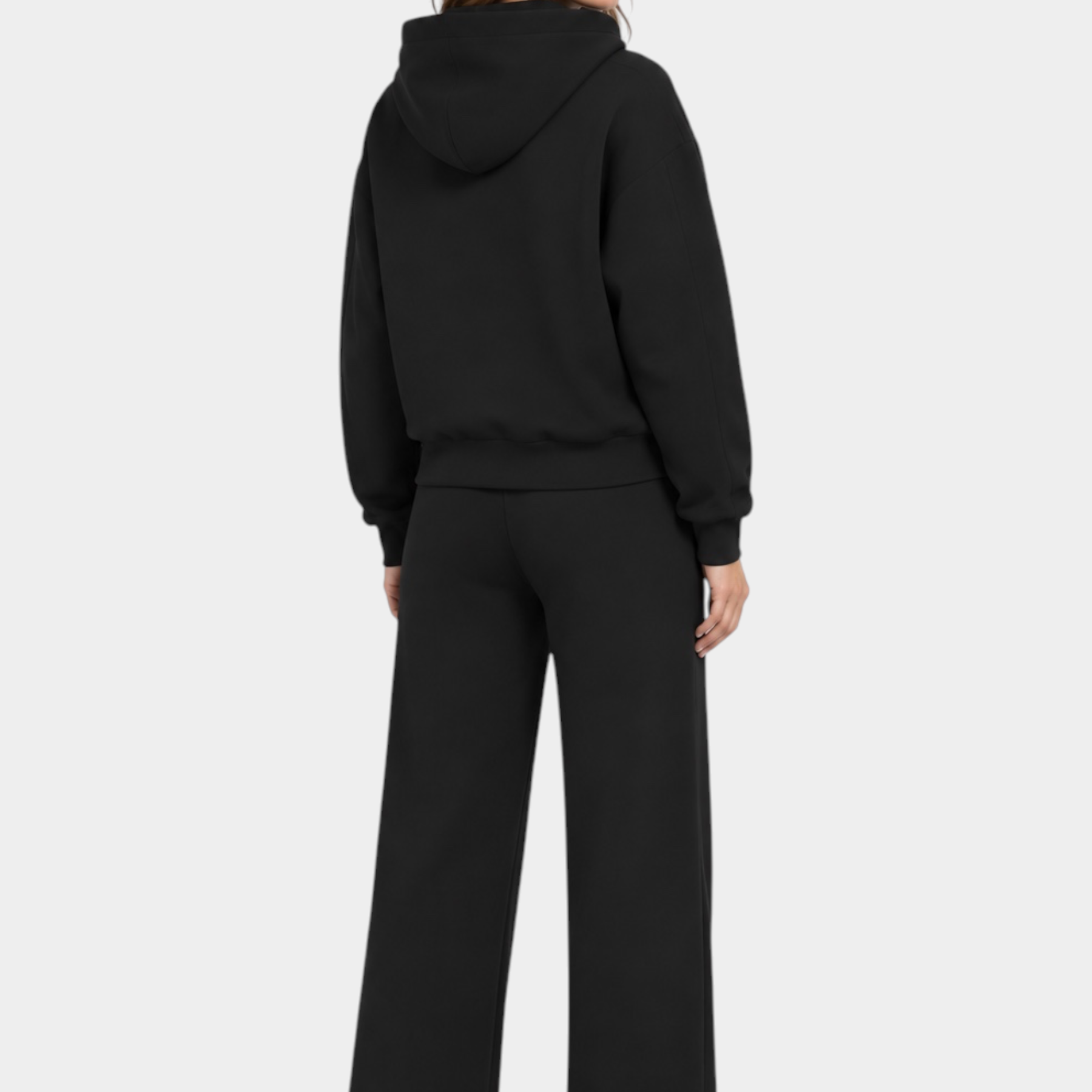 Donna di spalle indossa una felpa con cappuccio e pantaloni jogger neri Follower SRL in stile casual
