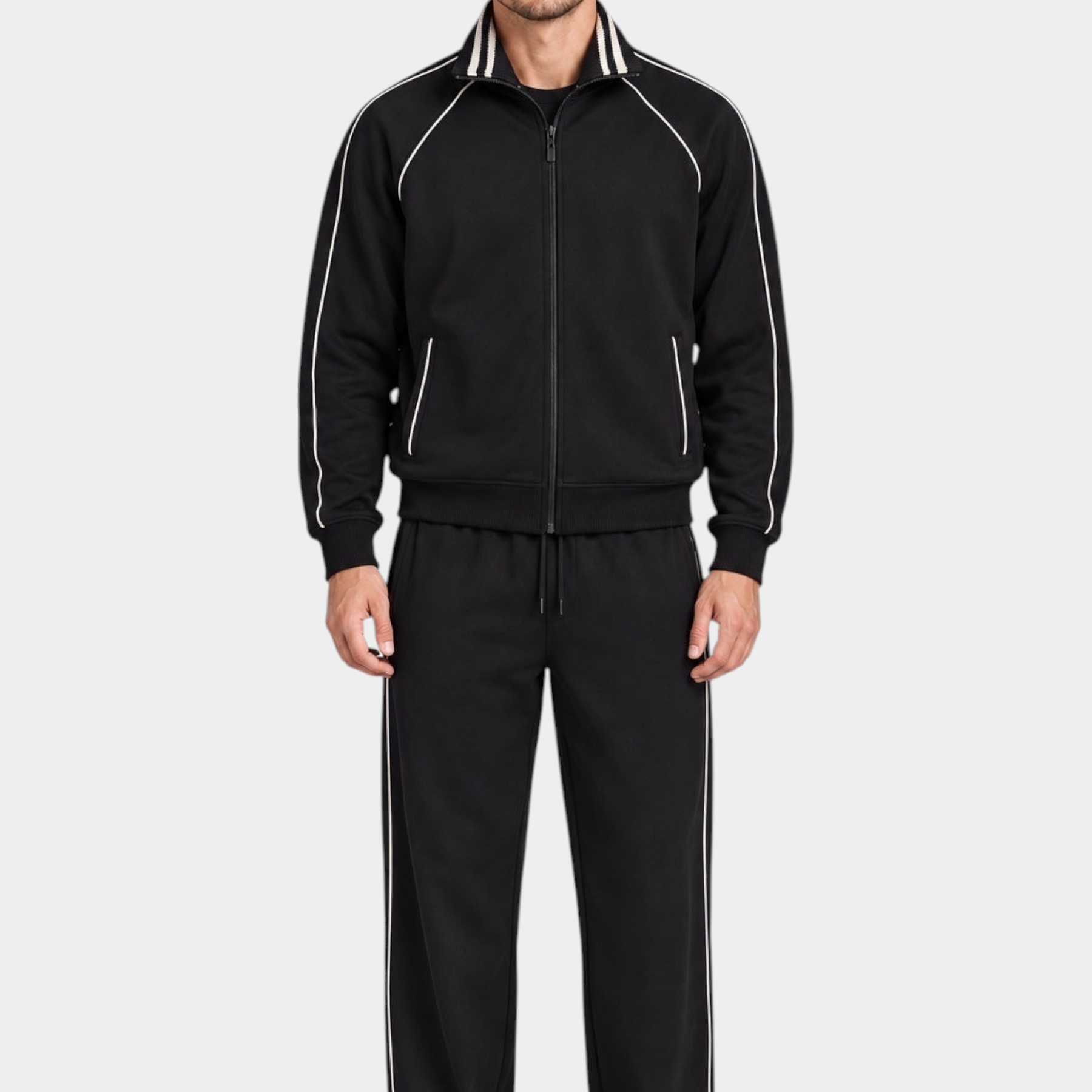 Modello indossa tuta sportiva nera Follower SRL con zip intera, colletto alto e dettagli a righe bianche a contrasto