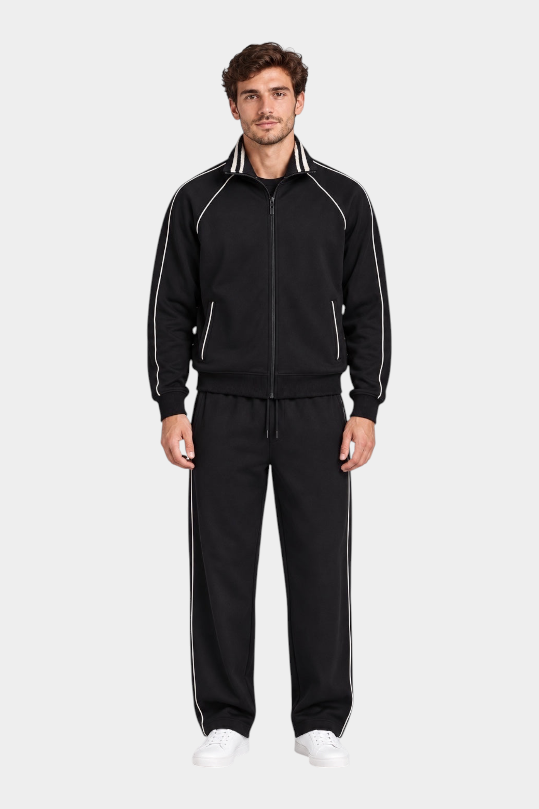 Modello indossa tuta sportiva nera Follower SRL con zip intera, colletto alto e dettagli a righe bianche a contrasto